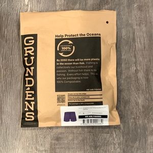 BRAND NEW Grundens women’s fish head board shorts. With original bag.